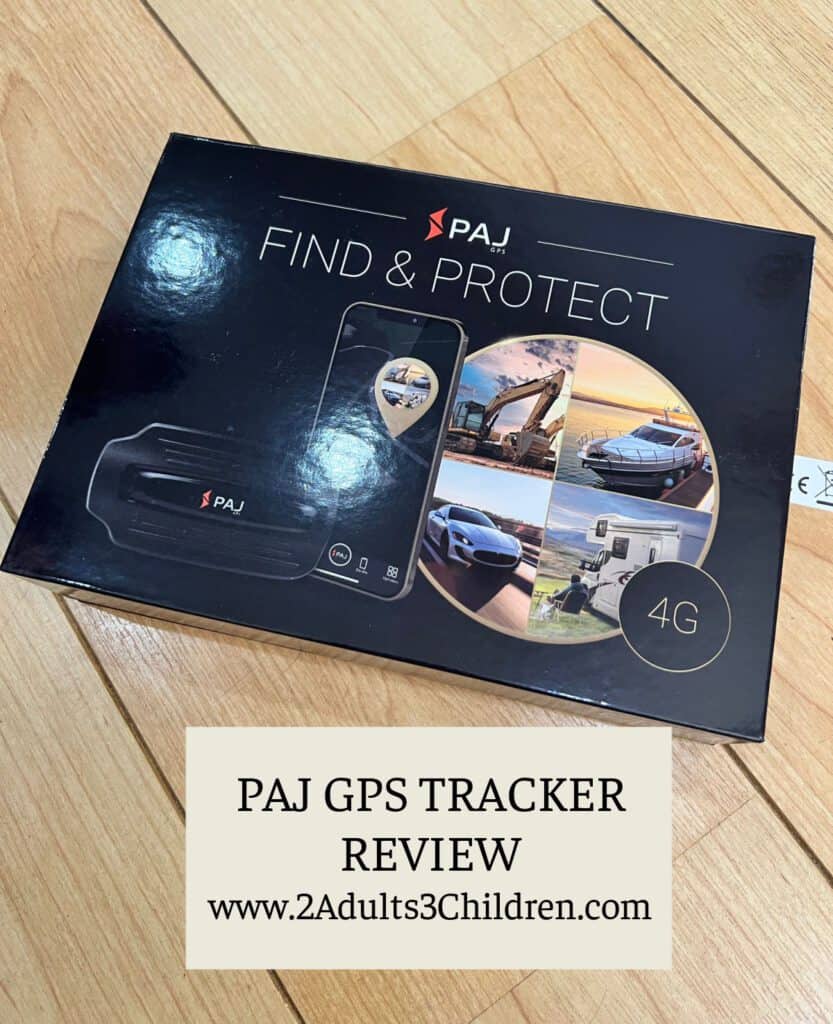 Box containing a paj gps tracker on a wooden surface